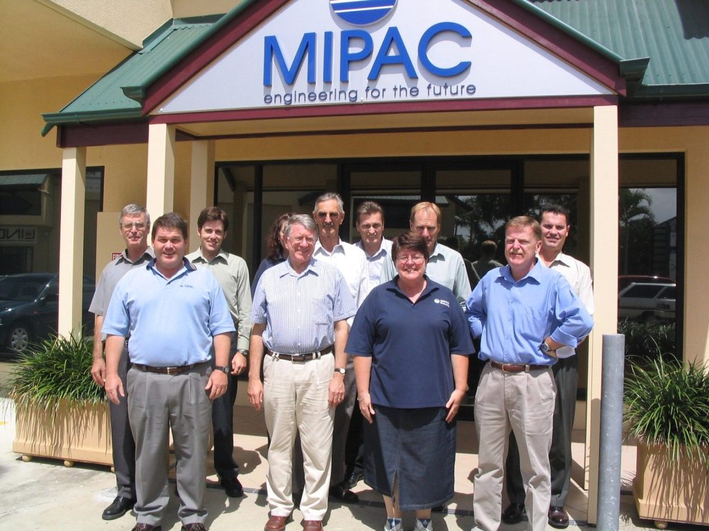 Historical photo of Mipac team in front of old office